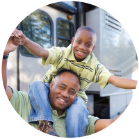 Dad and son having fun with their recreational vehicle